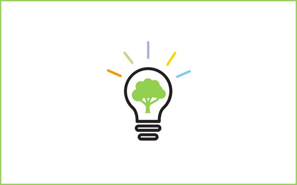 A lightbulb with a green tree inside and colorful lines radiating symbolizes eco-friendly innovation.